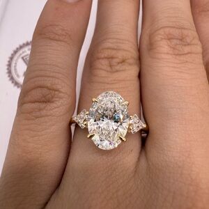 3.03 carat E VVS2 oval lab diamond center with kite diamonds engagement ring